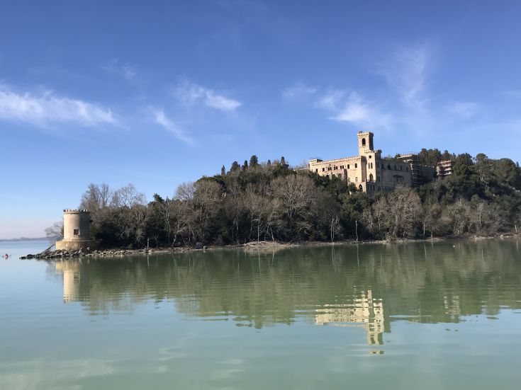 Lake Trasimeno with an island reflected in the calm water