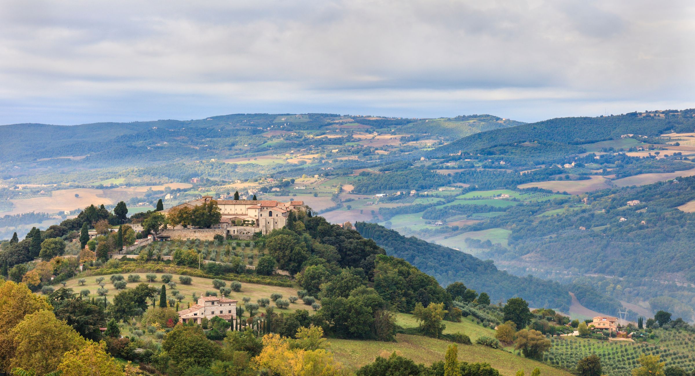Rolling hills, countryside and a hilltop settlement in Umbria